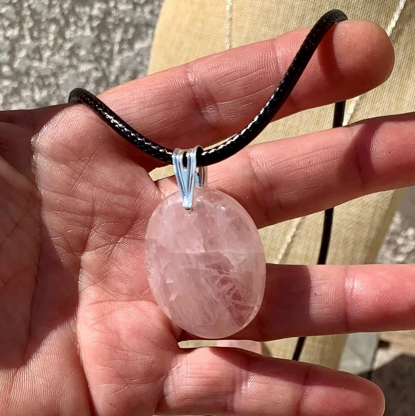 Natural rose quartz pendant with its silver chain