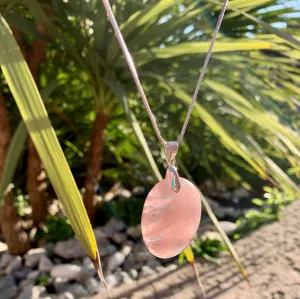Natural rose quartz pendant with its silver chain