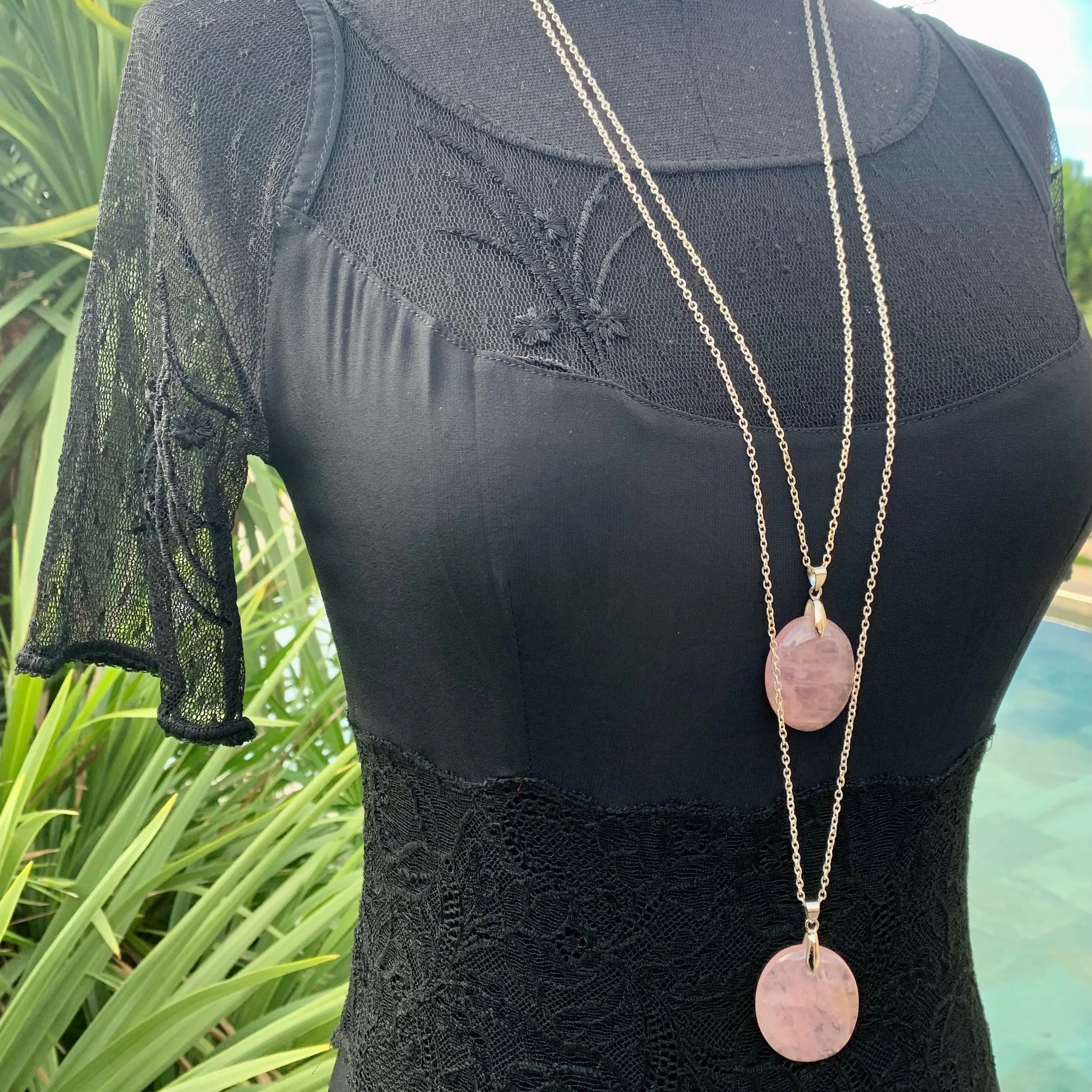 Natural rose quartz pendant with its silver chain
