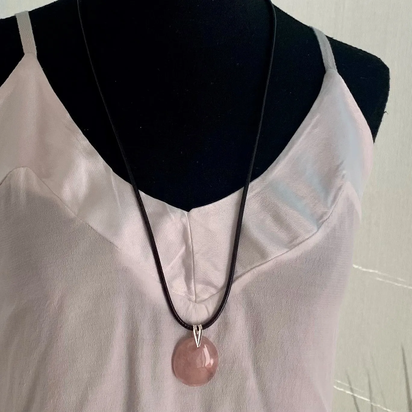 Natural rose quartz pendant with its silver chain