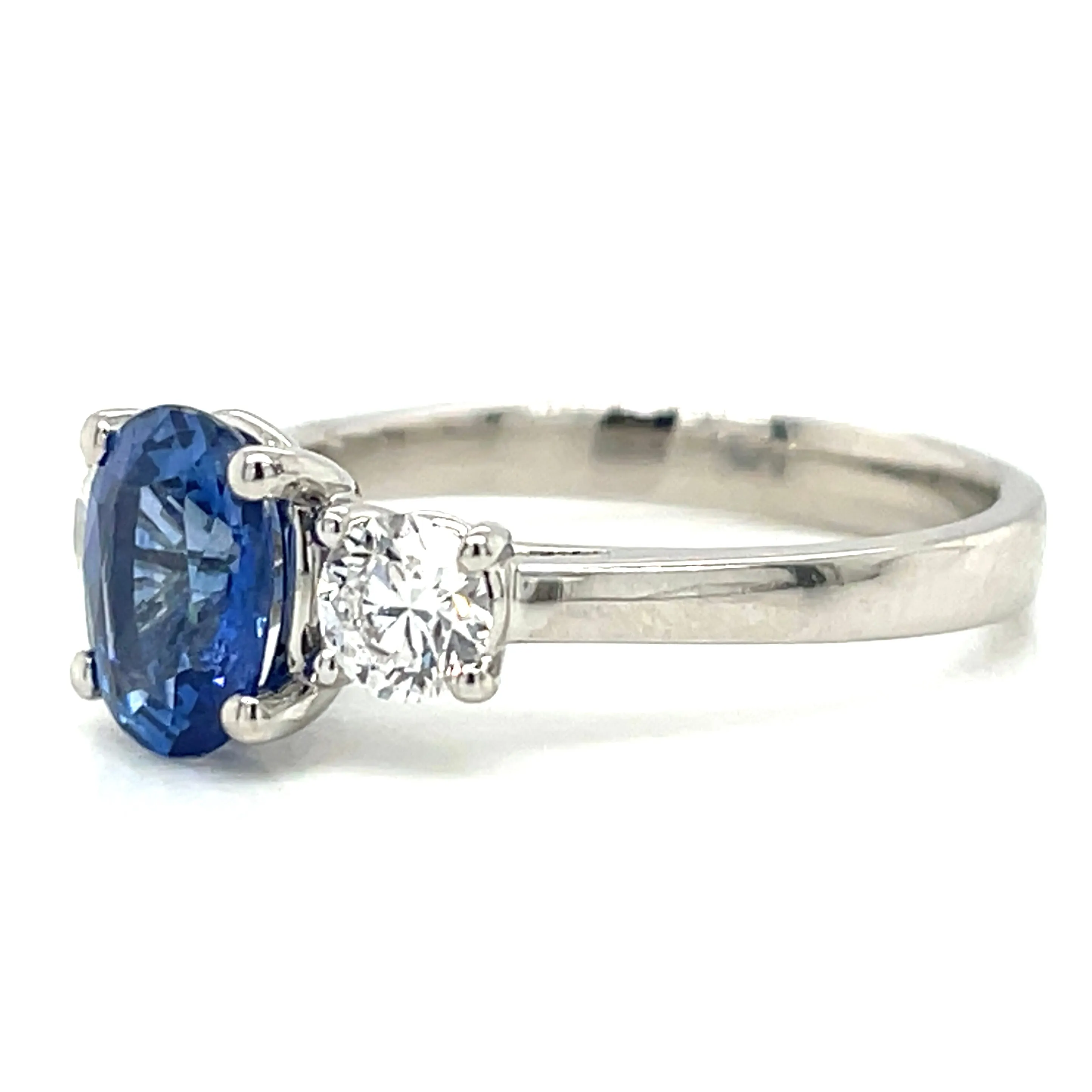 Platinum Earth Grown Oval Ceylon Sapphire With Side Diamonds Three Stone Ring